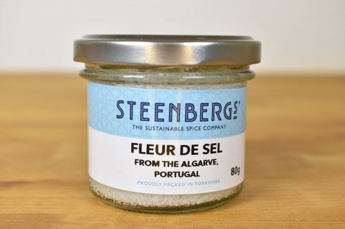 Steenbergs Fleur De Sel, flaky sea salt, sun dried in the Algarve and packed in glass.