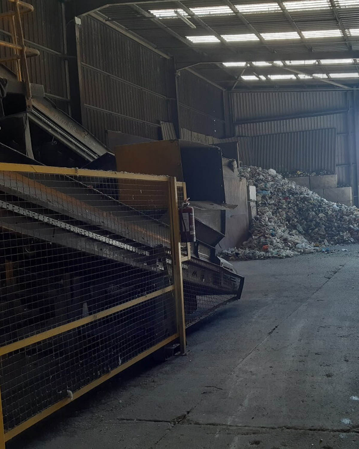 Raw Mixed Recycling Ready To Go Through Mechanical Sorting (On Left) Raw Mixed Recycling Ready To Go Through Mechanical Sorting (On Left)